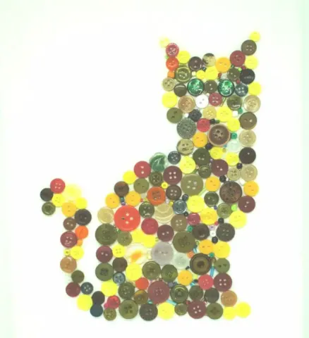 A cat silhouette made of buttons.