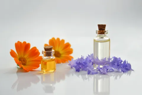 Essential oil bottle with flowers.