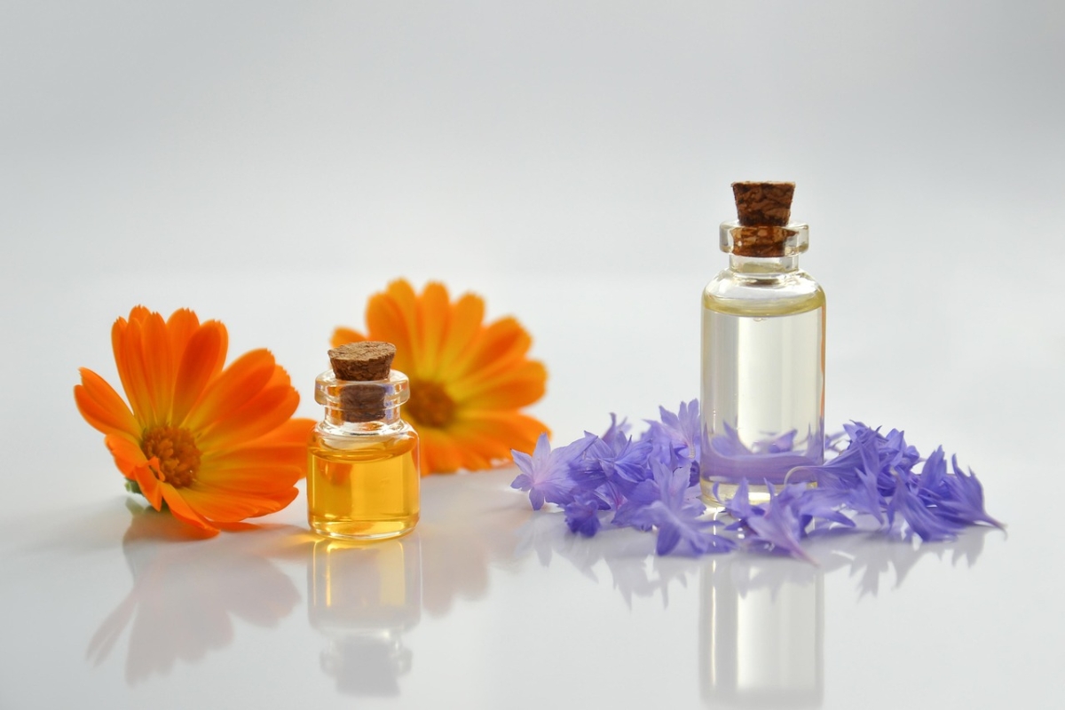 Essential oil bottle with flowers.